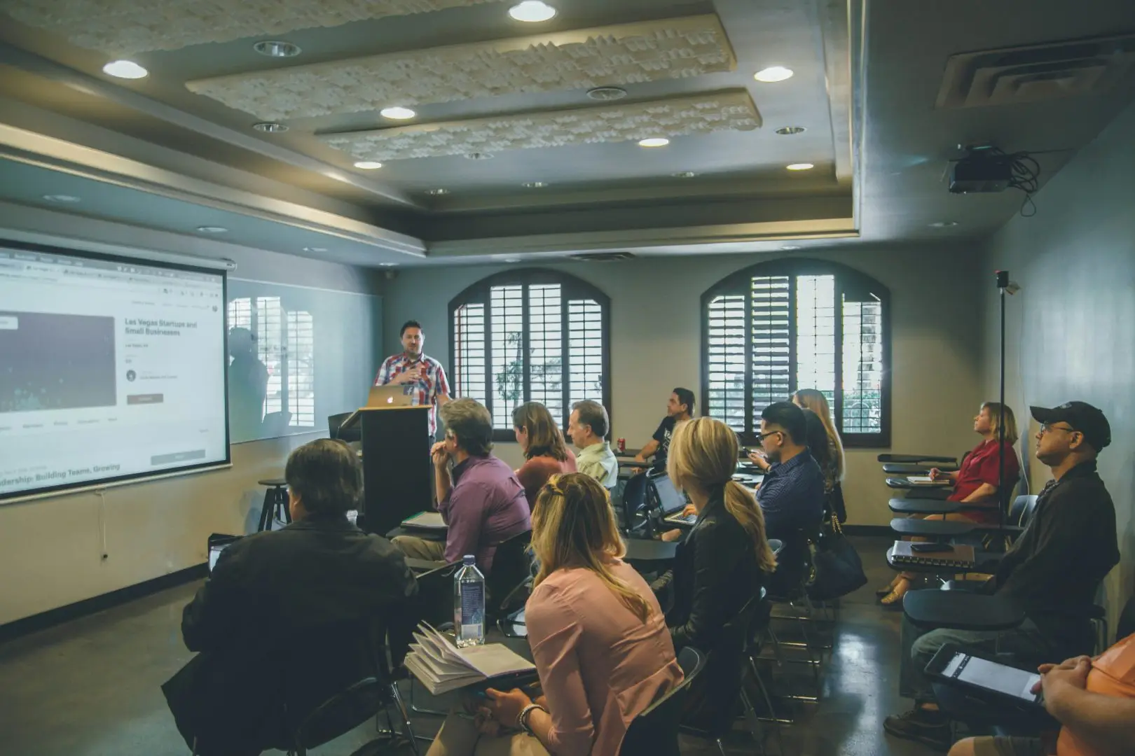 A group of people in an educational seminar