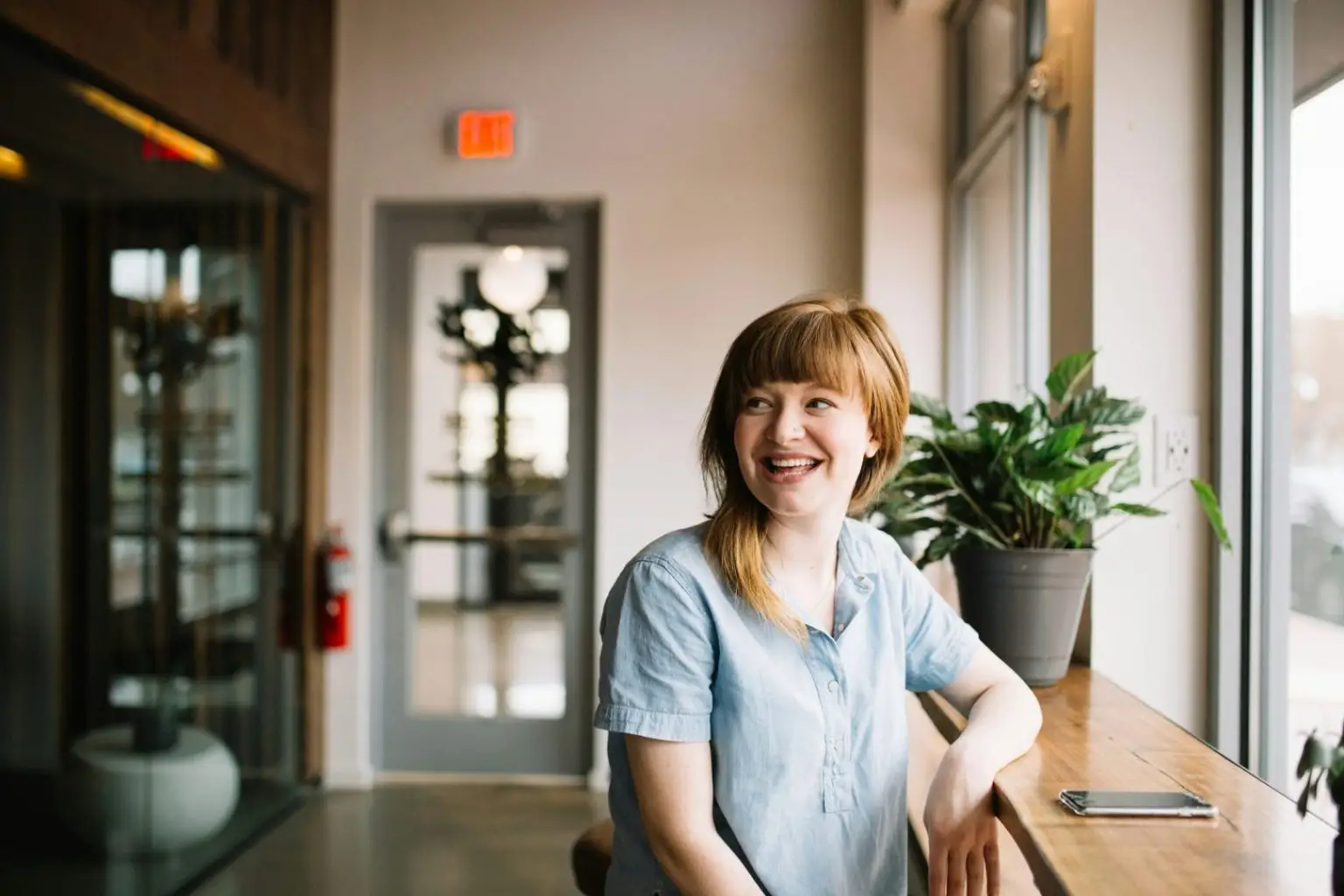 Woman smiling at a coffee shop