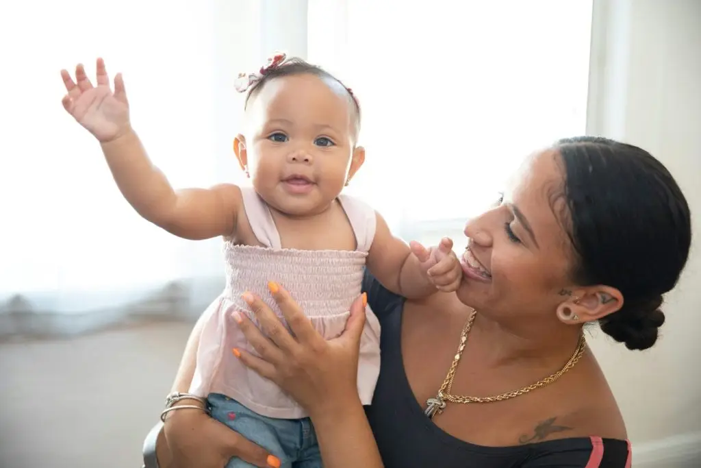 Woman playing with a baby