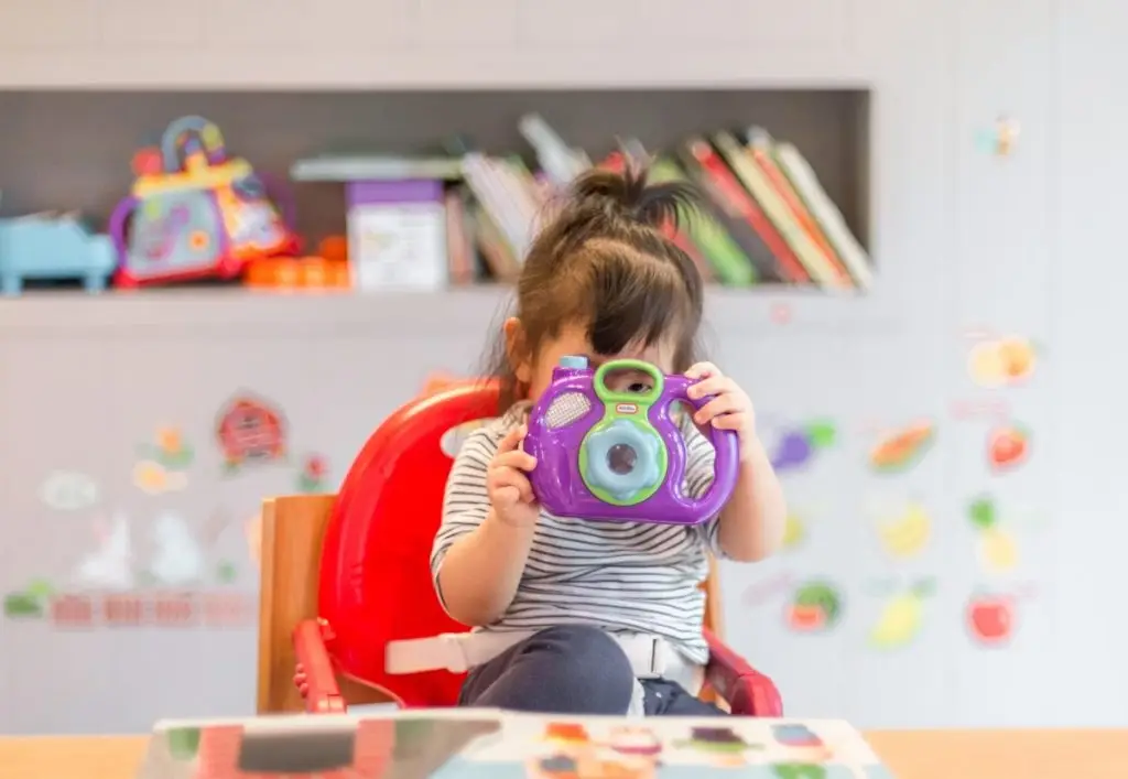 Happy baby playing in a playroom